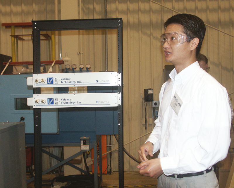 John Nguyen of Valence demonstrates the U Charge system at AEP's labs— these tiny racks of lithium batteries have a fraction of the footprint of traditional lead-acid systems