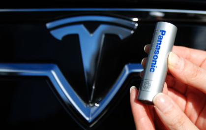 Panasonic cell in front of Tesla logo