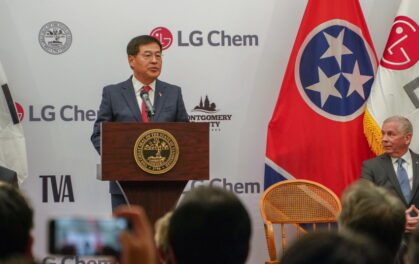man speaking at lectern