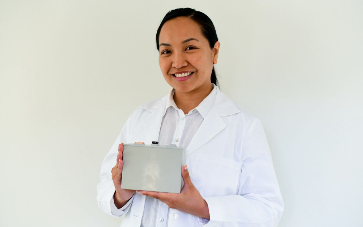 woman holding battery