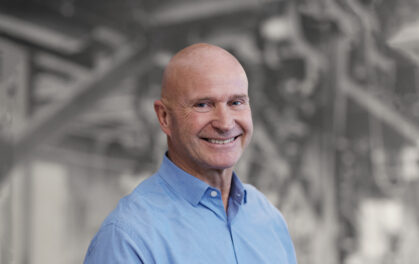 head and shoulders of smiling man