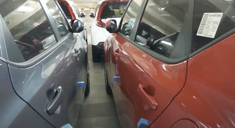 Cars parked on a car carrier ship are too close to move between even without fire equipment.