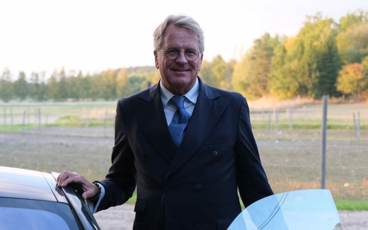 man standing by car
