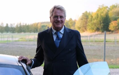 man standing by car