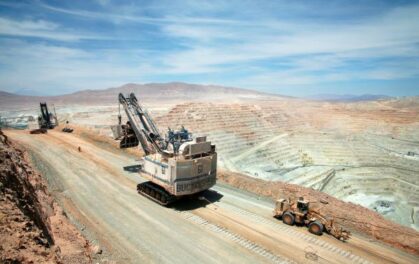 Mining machinery on a dusty track