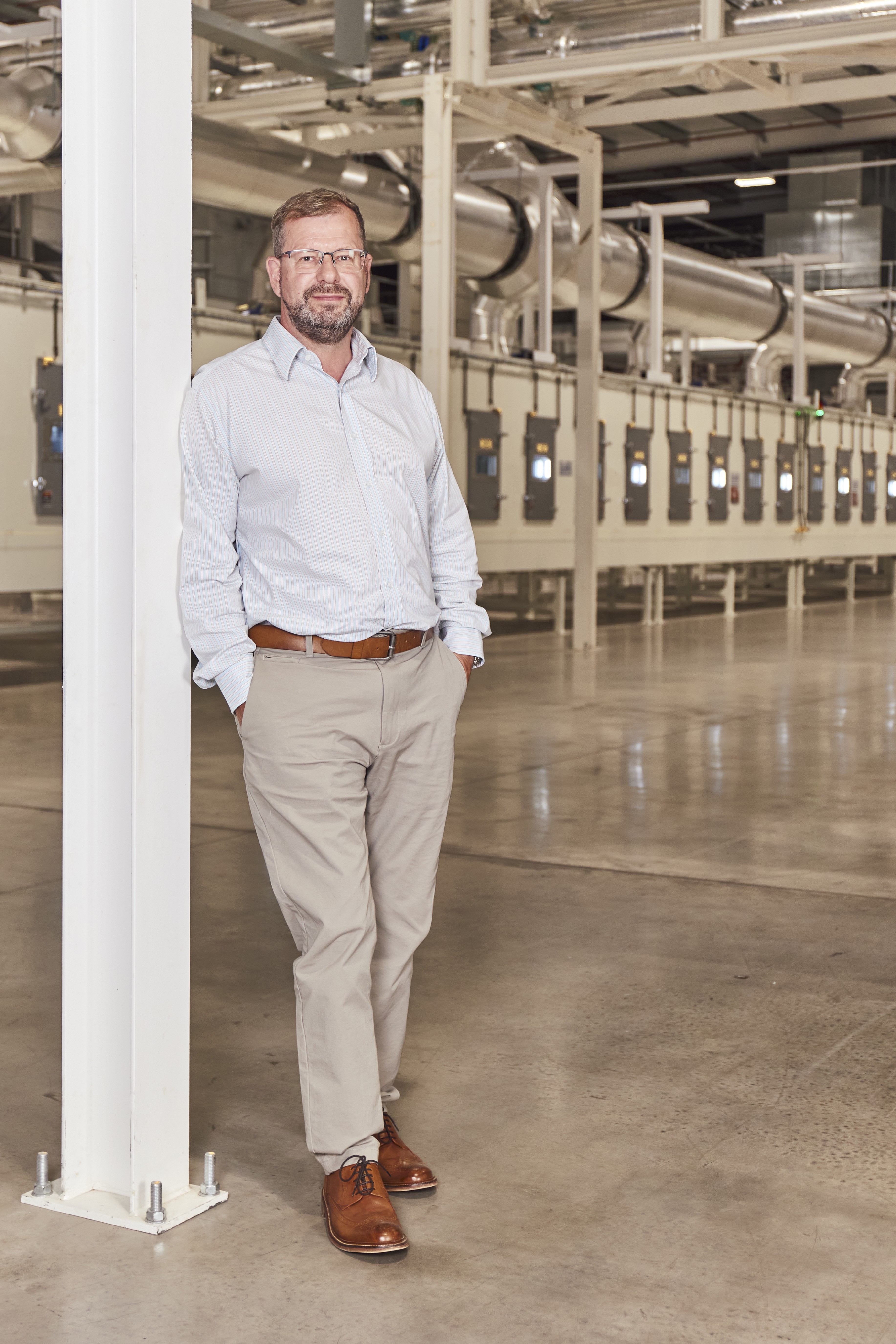 man leaning against pillar