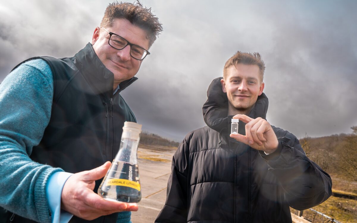 two men holding samples