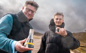 two men holding samples