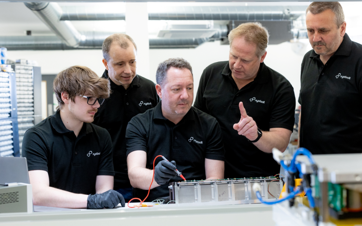 four male battery testers at a battery