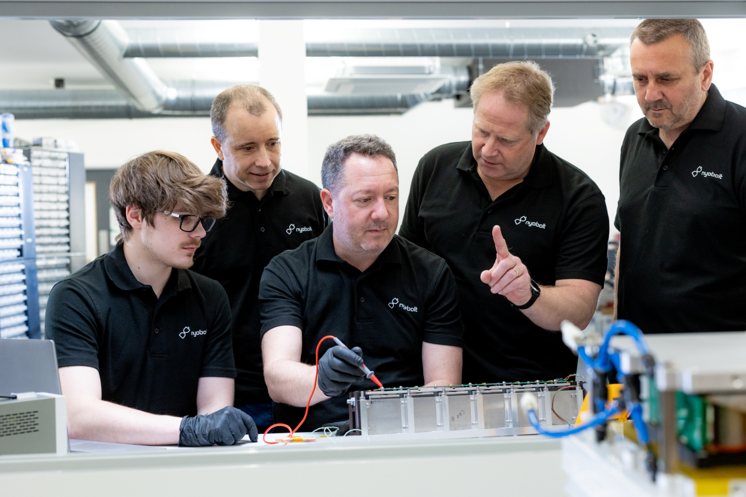 four male battery testers at a battery