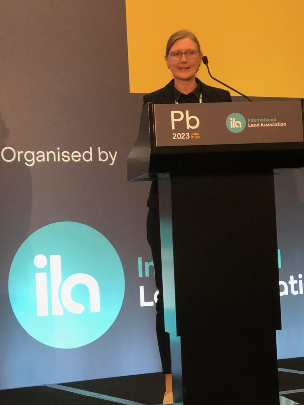 Woman speaking at podium