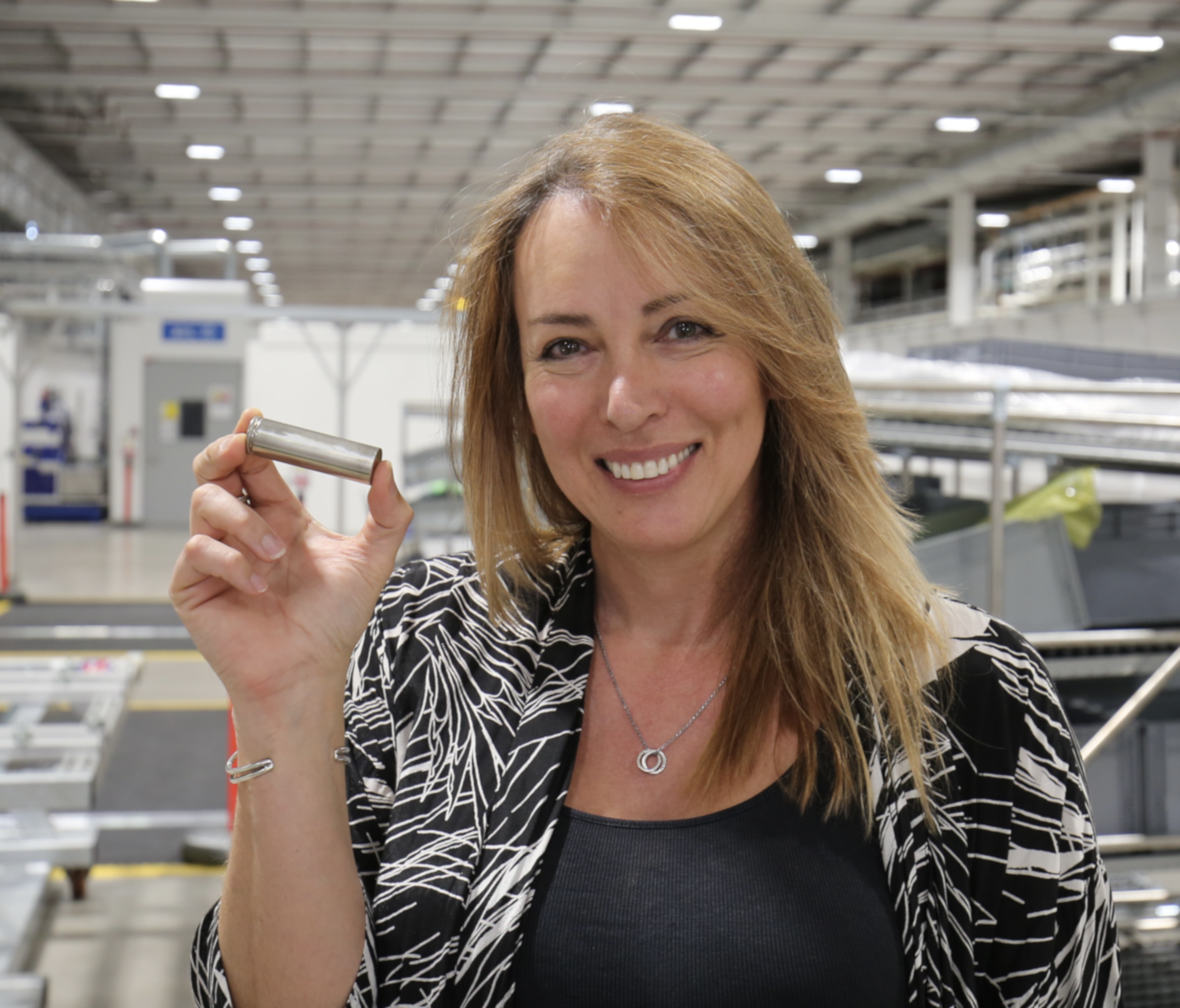 woman holding battery cell