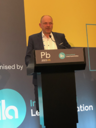 man at podium