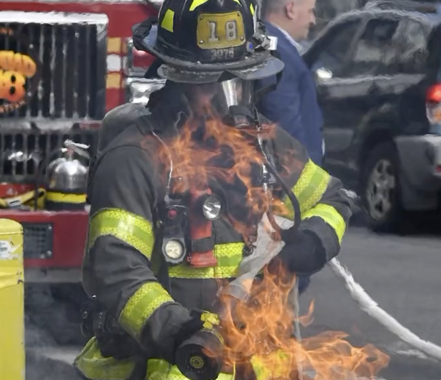 New York fire fighter disposing of burning battery