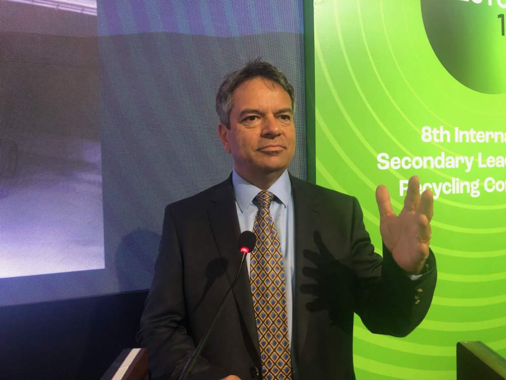 man speaking at lectern