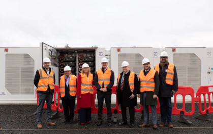 people in hi-vis jackets standing in a row