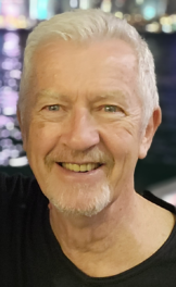 man smiling, head and shoulders