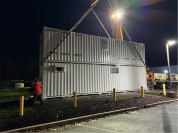 lifting containers into place in the dark