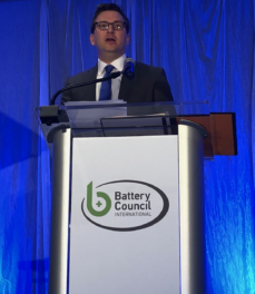 man speaking at lectern
