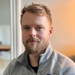 head and shoulders of man with beard