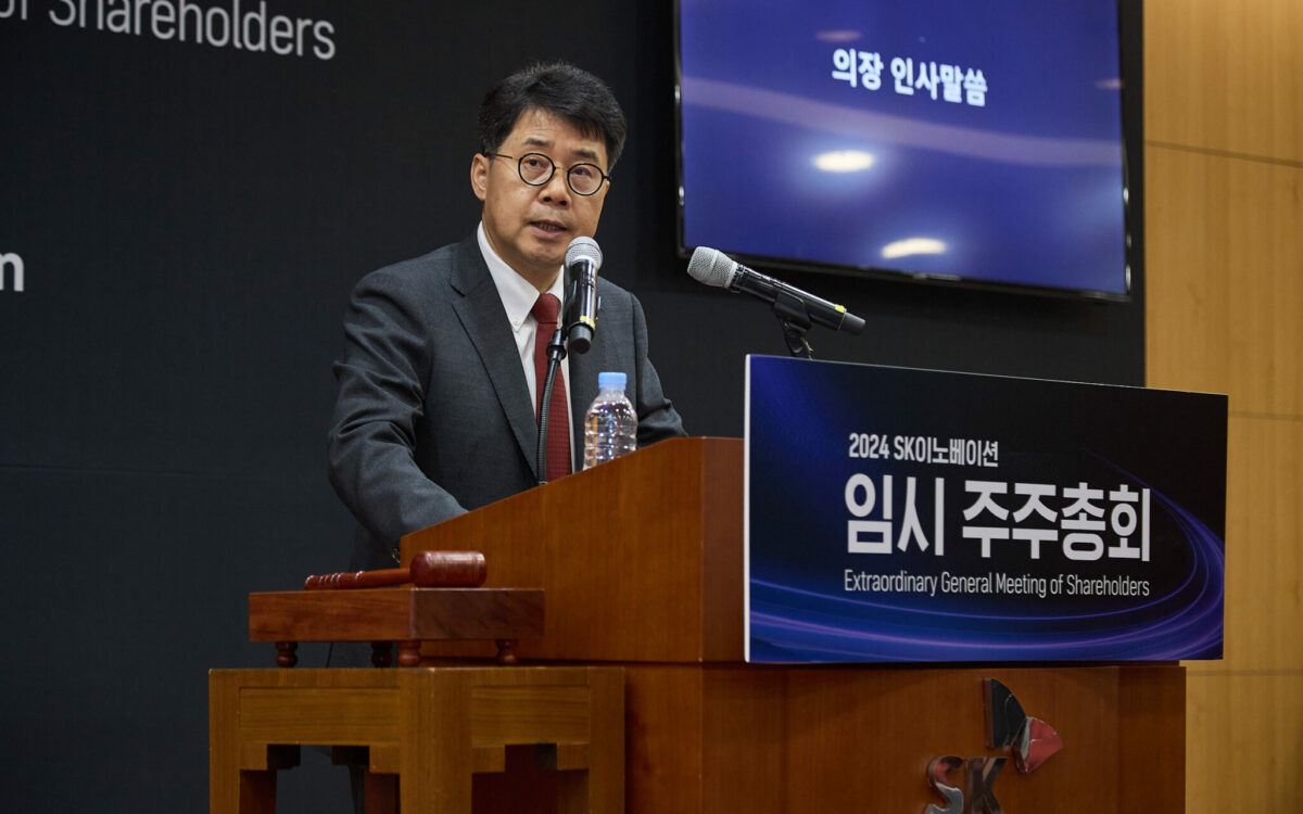 man speaking at podium
