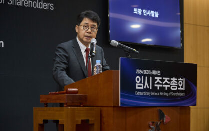man speaking at podium