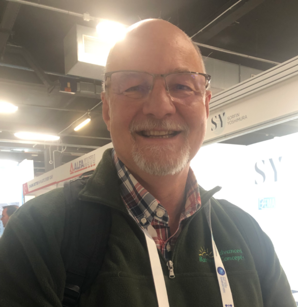 heaad and shoulders of smiling man