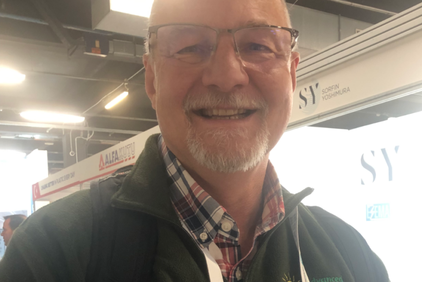 heaad and shoulders of smiling man