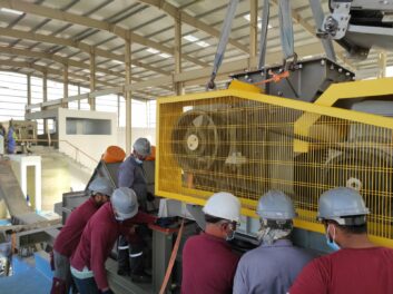 men installing machinery
