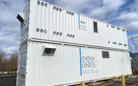 2 white shipping containers stacked