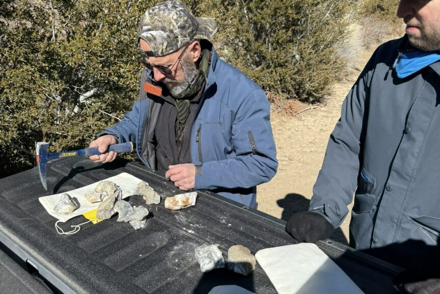 man examining rock samples